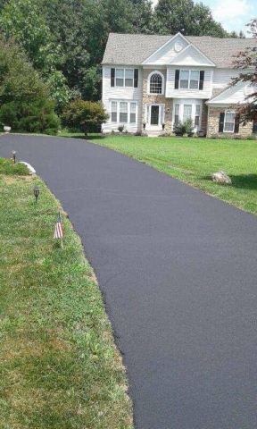 Seal Coating in Harford County Photo - White Colonial Home with Seal Coated Driveway