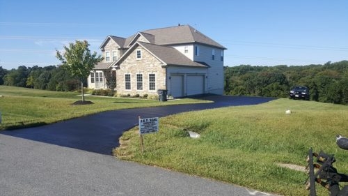 Seal Coating in Harford County Photo - Large Colonial Home with Complete Driveway Seal Coated