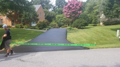 Seal Coating in Harford County Photo - Landscaped Yard and Seal Coated Driveway