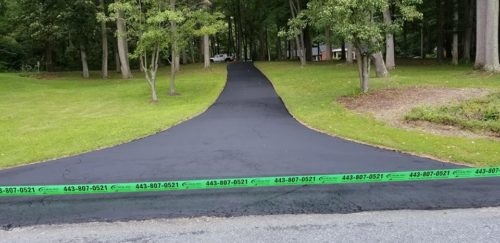 Seal Coating in Harford County Photo - Long Lane with Trees on Each Side