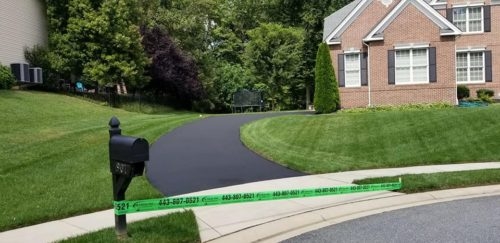 Seal Coating in Harford County Photo - Suburban Home with Curved Driveway